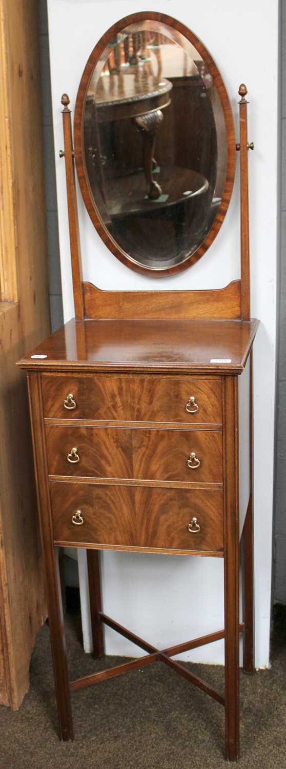 An Edwardian-Style Mahogany Shaving Stand, the oval mirror on twin tapered supports, on a base