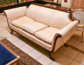 A Regency-Style Mahogany-Framed Three Seater Sofa in Striped Upholstery, with outscrolled arms,