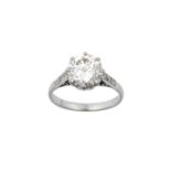 A Diamond Solitaire Ring the round brilliant cut diamond in a white claw setting, to an eight-cut