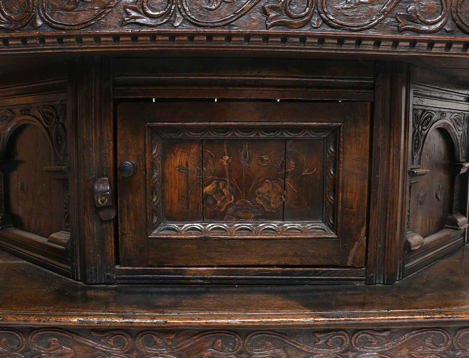 A Joined Oak Standing Livery Cupboard, early 17th century, the boarded top above a carved frieze and - Image 3 of 14