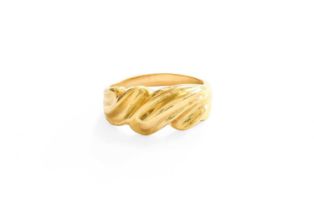 A Crossover Motif Ring, with applied plaque stamped '750', finger size N Gross weight 5.2 grams.