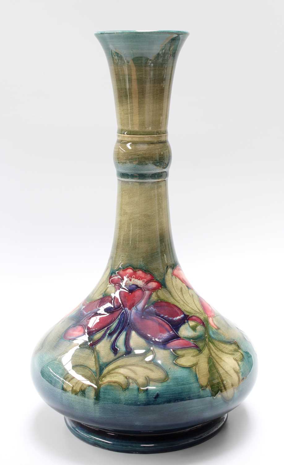 A Walter Moorcroft Columbine Pattern Vase, with painted and impressed marks, 31cm high Crazed but