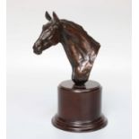 Priscilla Hann (b.1943), A Cast Bronze Bust of a Horses Head, on wooden base, signed, 21.5cm high