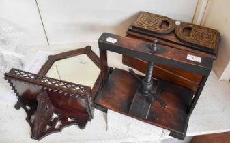 A 19th Century Mahogany Lace Press. A 19th Century mirrored mahogany wall bracket with pierced