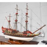 A Painted Wooden Model of a Triple Masted Ship, 112cm by 91cm