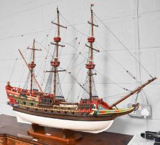 A Painted Wooden Model of a Triple Masted Ship, 112cm by 91cm