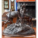 A 20th Century Russian Bronze of a Roebuck and Doe, on a naturalistic base, from the Kasli Iron