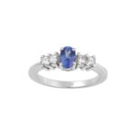 A Tanzanite and Diamond Five Stone Ring, the oval cut tanzanite flanked by pairs of princess cut