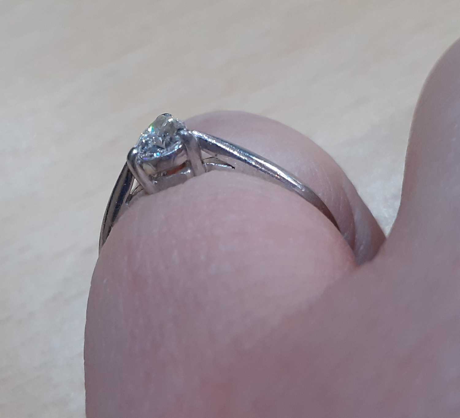 A Platinum Diamond Solitaire Ring, the pear cut diamond in a claw setting, to a tapered shoulder - Image 4 of 5