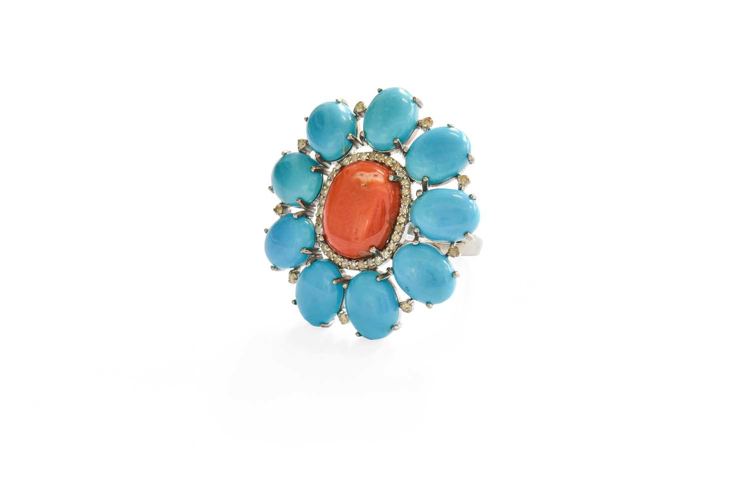 A Coral, Turquoise and Diamond Cluster Ring, the oval cabochon coral within a border of eight-cut