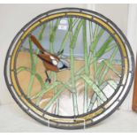 A Stained Glass Panel, of circular form, 20th century, a Bearded Tit amongst reeds, 55cm diameter
