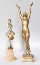 After Limousin, a Gilt Spelter Figure, of a naked maiden standing with hands raised above her