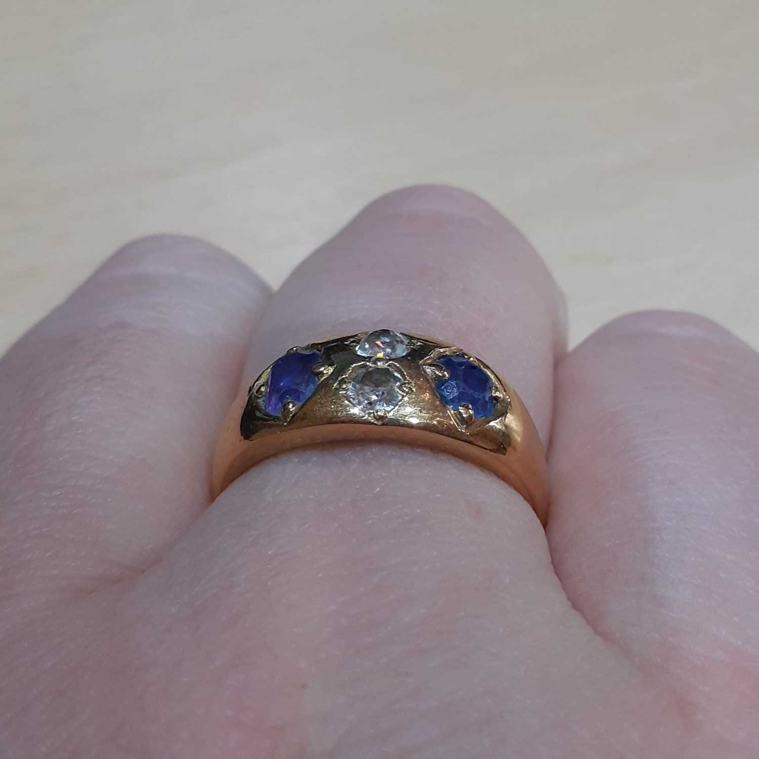 A Sapphire and Diamond Four Stone Ring, the oval cut sapphires spaced by two old cut diamonds, in - Image 3 of 5