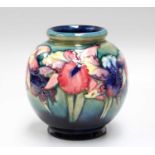 A Walter Moorcroft Orchid and Spring Flowers Vase, painted and impressed marks, 15cm Crazed