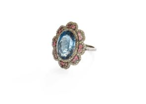 A Blue Topaz, Tourmaline and Diamond Cluster Ring, the oval cut blue topaz within a border of lasque