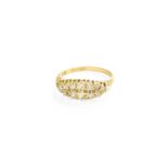 An 18 Carat Gold Diamond Cluster Ring, two rows of old cut diamonds in yellow claw settings, to a