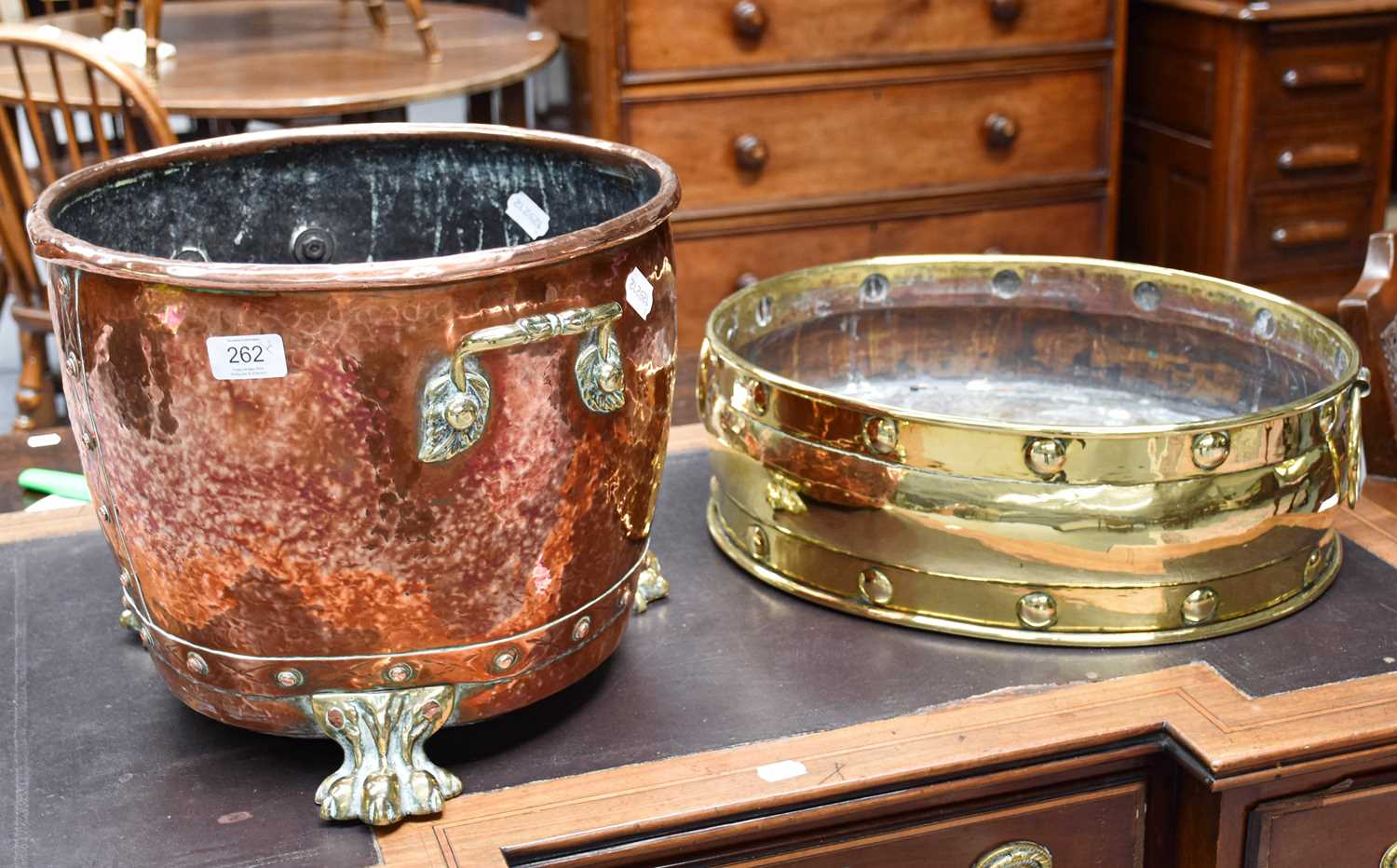 A 19th Century Copper and Brass Twin Handled Log Bin, on paw feet, 30cm high; together with a