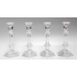 A Set of Four Baccarat Candlesticks, of faceted hexagonal form, 20cm high Overall good condition
