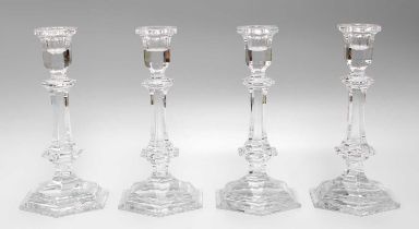 A Set of Four Baccarat Candlesticks, of faceted hexagonal form, 20cm high Overall good condition