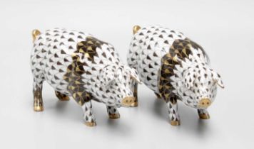 A Pair of Herend Porcelain Models of Pigs, 13cm A loss to the ear of one pig, otherwise ok