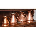 Four Graduated 19th Century Copper Harvest Jugs Weld repair to the gallon jug handle, one of the 2