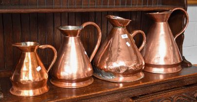 Four Graduated 19th Century Copper Harvest Jugs Weld repair to the gallon jug handle, one of the 2