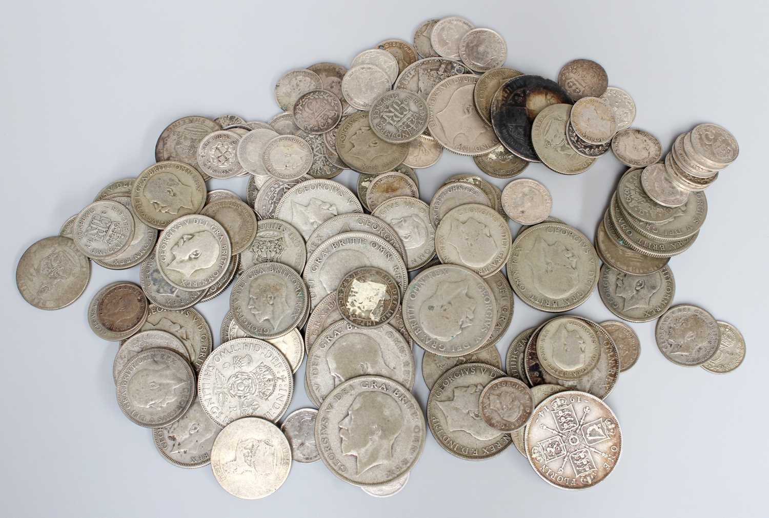 Assorted British Silver Coinage; mixed denominations and grades containing 112.6g of pre-20 silver