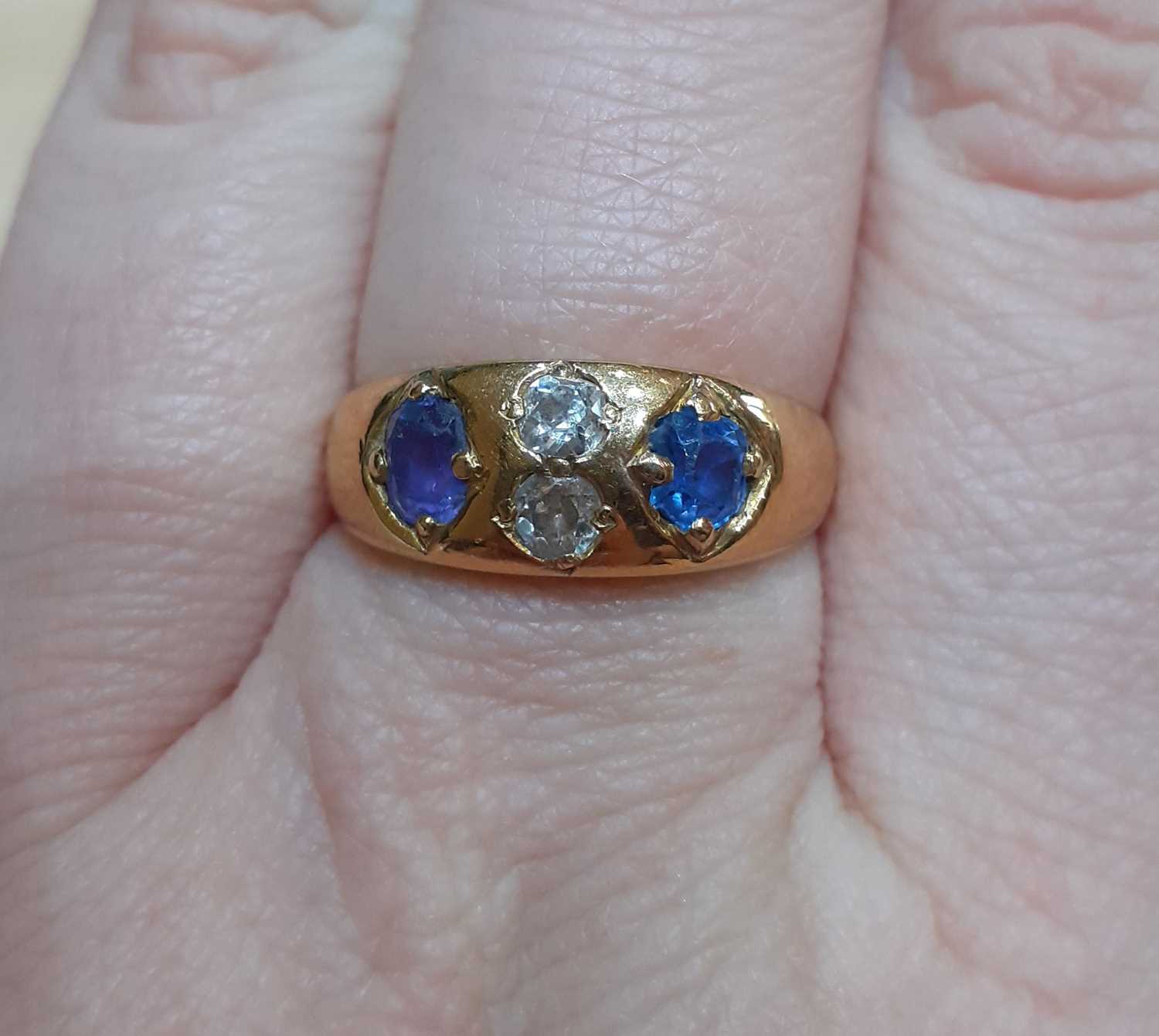 A Sapphire and Diamond Four Stone Ring, the oval cut sapphires spaced by two old cut diamonds, in - Image 2 of 5