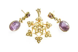 A Split Pearl Brooch/Pendant, the central floral cluster to an openwork trefoil motif border, set