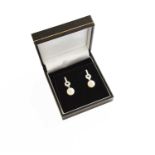 A Pair of 9 Carat White Gold Cultured Pearl and Diamond Drop Earrings, a row of round brilliant