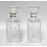 A Pair of Silver Collared Decanters, 25cm high