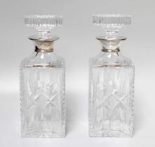 A Pair of Silver Collared Decanters, 25cm high