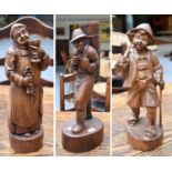 Three Wooden Carvings of Pastoral Figures, probably German, tallest 57.5cm