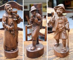 Three Wooden Carvings of Pastoral Figures, probably German, tallest 57.5cm
