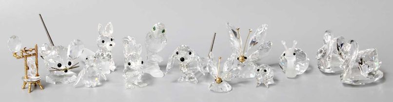 A Collection of Swarovski Glass, comprising thirteen various small figures and twenty nine boxed