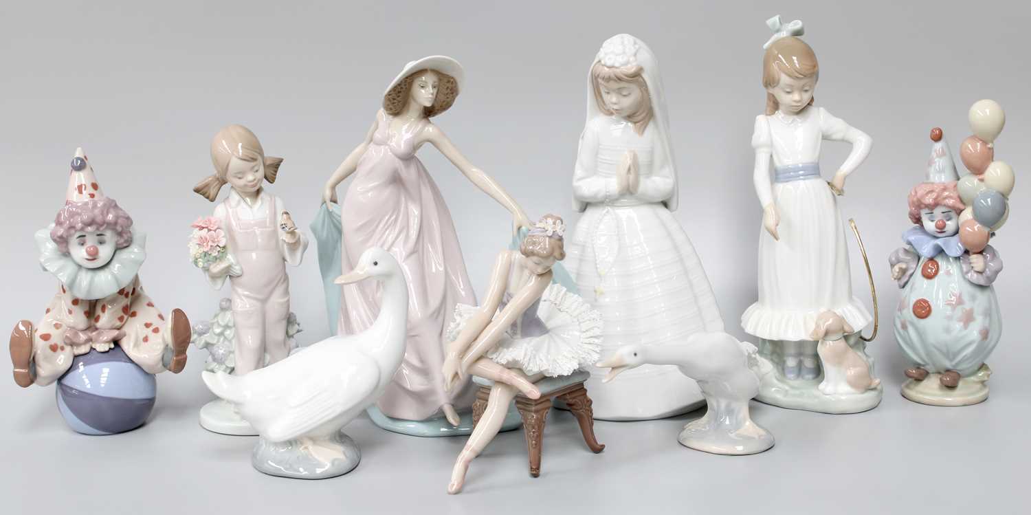 Six Lladro Figures, comprising a ballet dancer seated on a chair, a lady dancing, two clowns, a