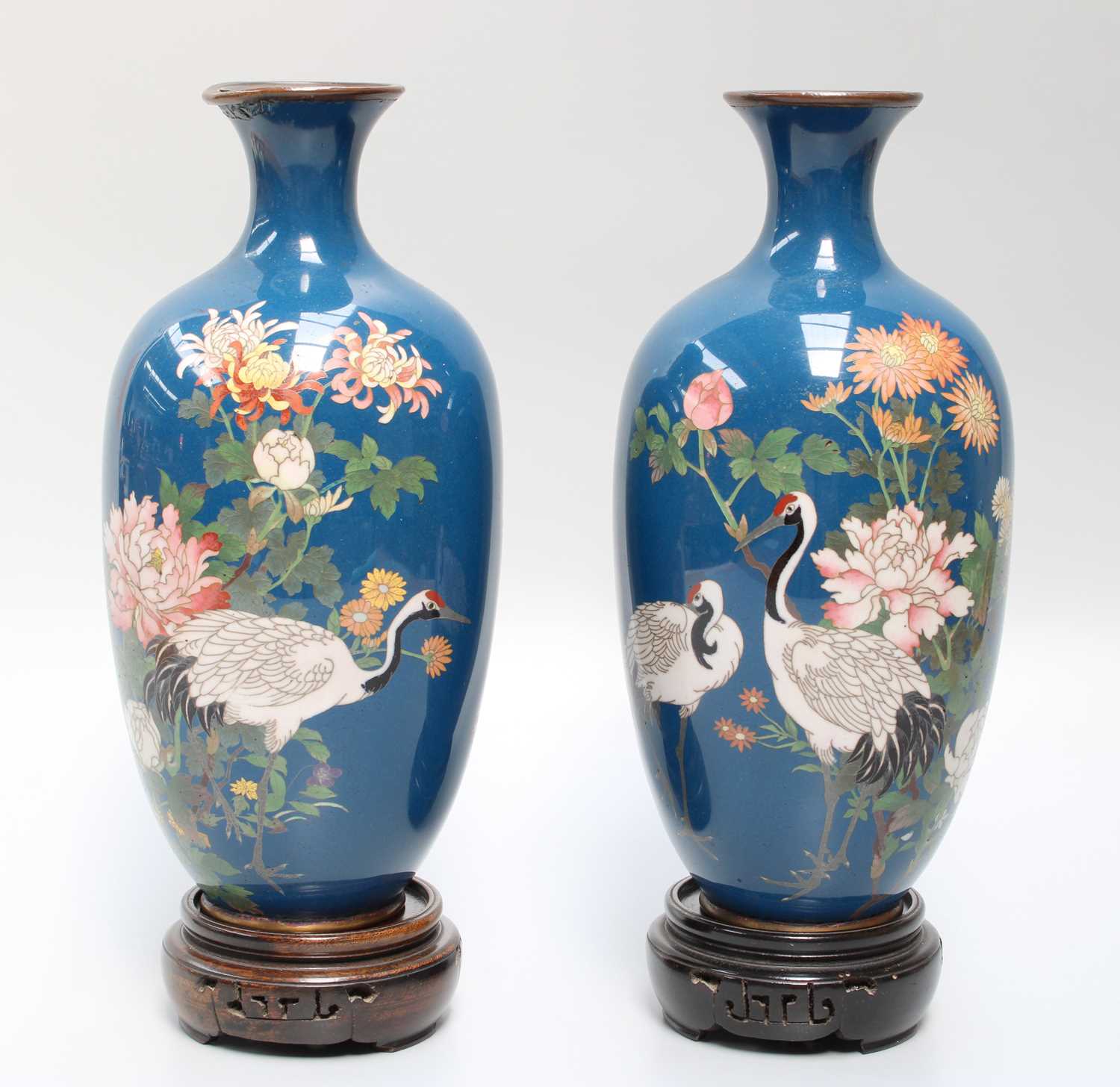 A Pair of Meiji Period Japanese Cloisonne Vases, decorated with cranes amongst blossoms on a blue