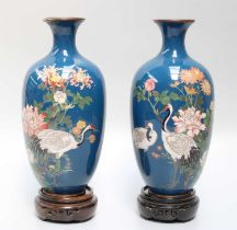 A Pair of Meiji Period Japanese Cloisonne Vases, decorated with cranes amongst blossoms on a blue