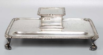 A George V Silver Inkstand, by Heming and Co Ltd., London, 1930, oblong and on four scroll feet,