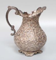 An Indian Silver Cream-Jug, Apparantly Unmarked, Late 19th Century, baluster and on four scroll