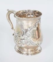 A George III Silver Mug, by William Shaw, London, 1764, baluster and on spreading foot, later chased