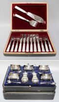 A Cased George V Silver Condiment-Set, each piece on lion-mask capped paw feet, comprising four