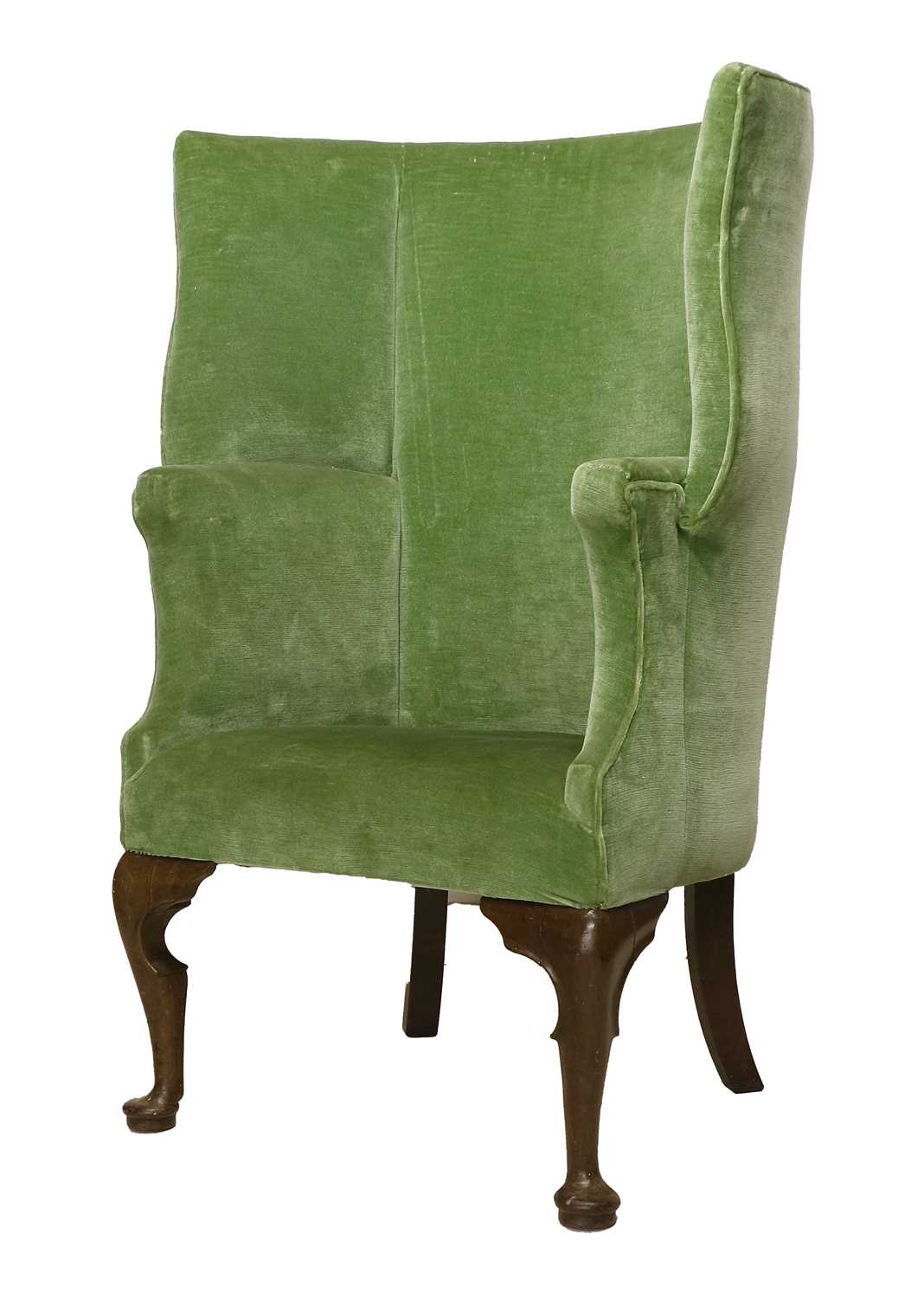 A George III-Style Barrel-Shaped Armchair, 19th century, covered in green velvet, with overstuffed