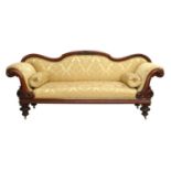 A Victorian Carved Mahogany Sofa, circa 1870, recovered in yellow and gold silk damask, with