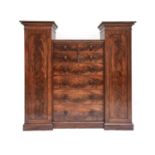 A Victorian Flame Mahogany Inverted Breakfront Wardrobe. 3rd quarter 19th century, the wings with