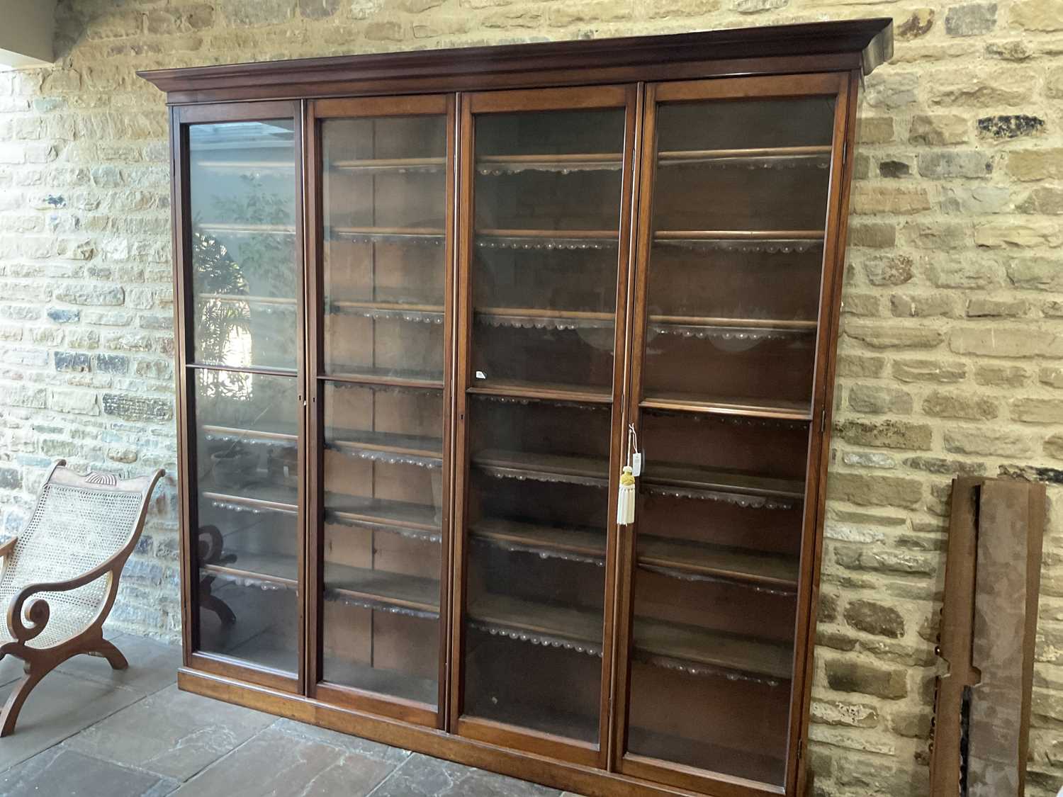 A Victorian Mahogany Bookcase, the moulded cornice above four conforming glazed doors enclosing - Image 10 of 10
