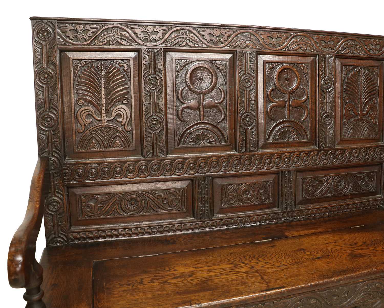 An 18th Century Carved Oak Box Settle, the back support with four panels carved in relief with - Image 2 of 2