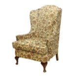 A George III-Style Wing-Back Armchair, late 19th/early 20th century, recovered in beige, green and