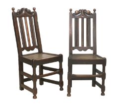 A Pair of Joined Oak Back Stools, circa 1700, the C scroll carved top rails above fluted uprights,