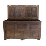 A Late 17th/Early 18th Century Joined Oak Chest, the hinged lid with four moulded panels enclosing a